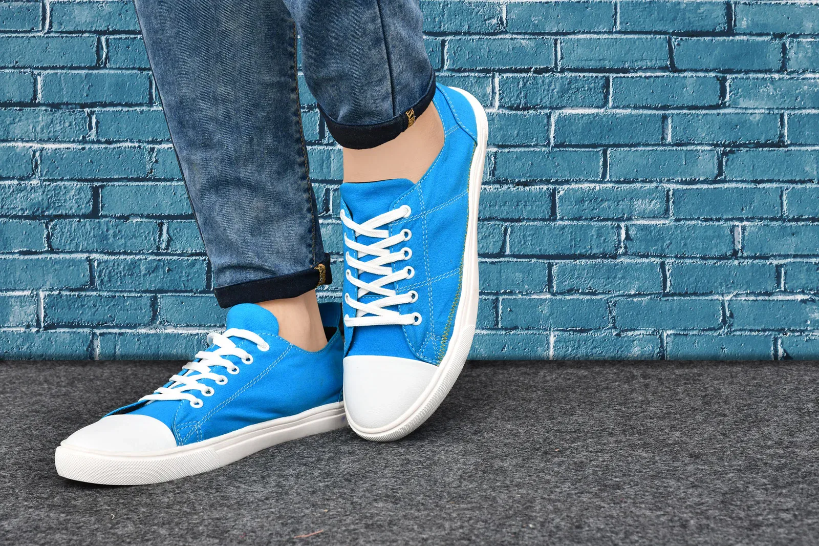 Blue Casual Shoes for Men – Casual, Stylish & Comfortable 5 A fashionable blue canvas sneaker with white laces and a white rubber sole, featuring a clean toe design, perfect for street-style fashion and casual wear