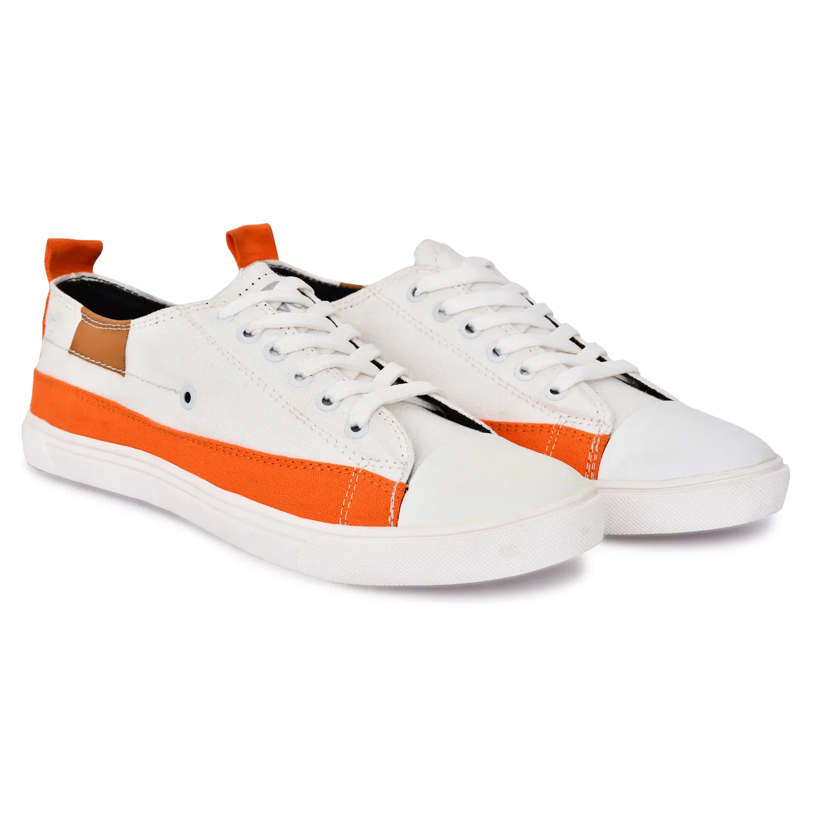 A pair of low-top canvas sneakers in white with bright orange accents, featuring white laces, a brown leather tab at the back, and a comfortable white rubber sole.